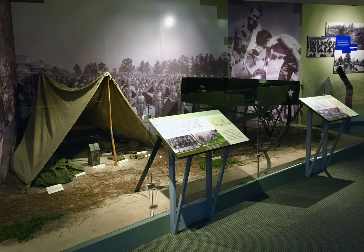 A museum exhibit of a tent inside the US Army Basic Combat Training Museum.